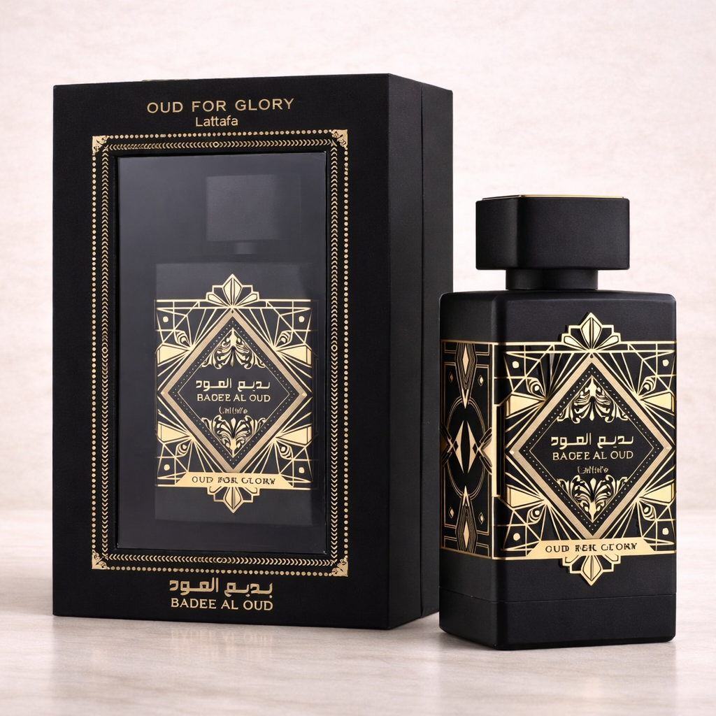 Perfume bottle and packaging with gold accents on a light background