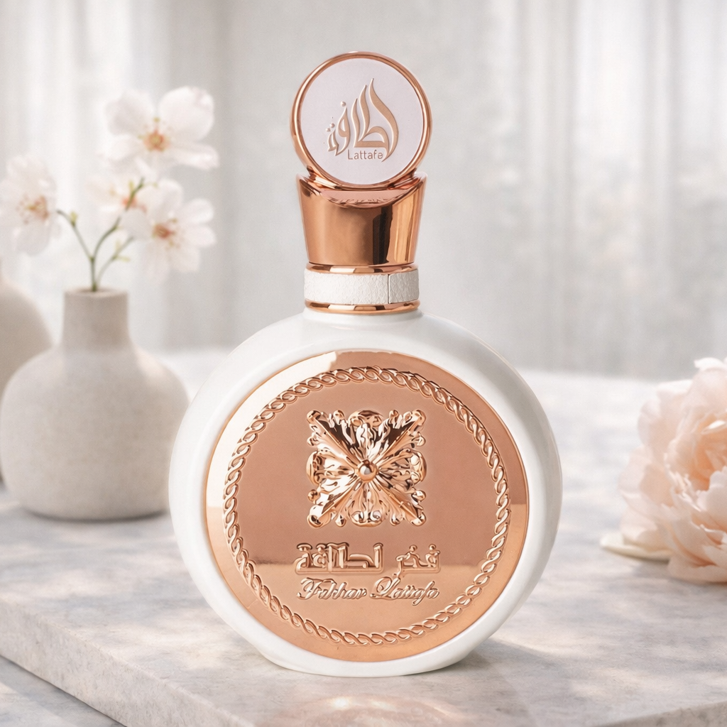 Perfume bottle with decorative design on a marble surface with flowers