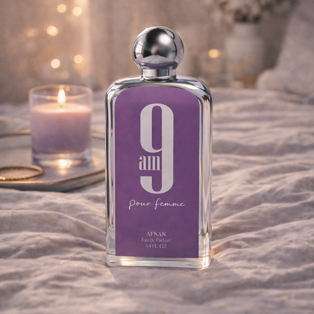 Perfume bottle labeled '9' on a textured surface with soft lighting