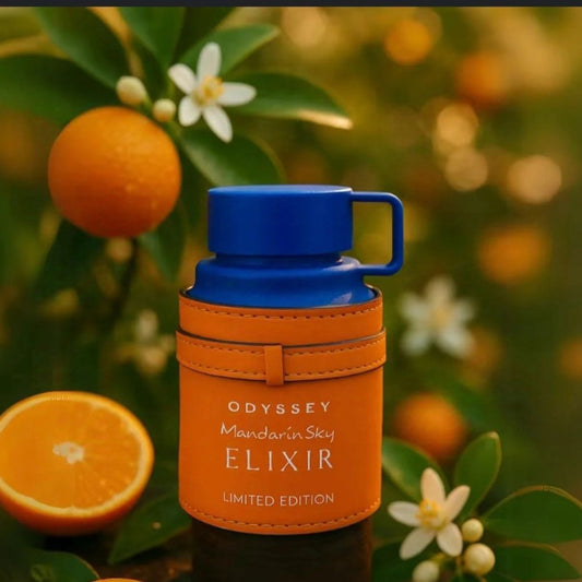 Orange elixir bottle with blue cap on a natural background with mandarins and flowers